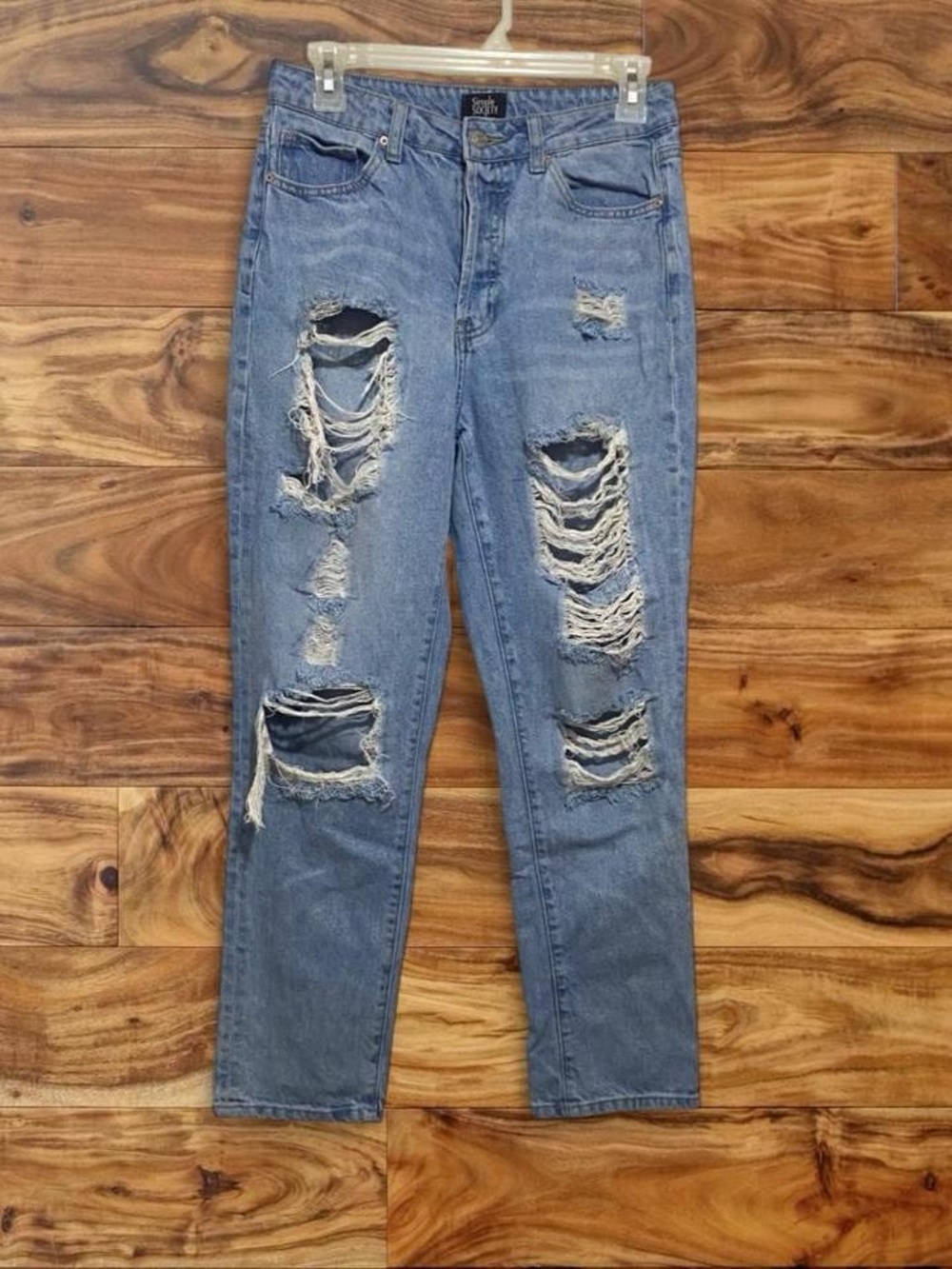 Women’s Distressed Boyfriend Jeans in Light Blue
